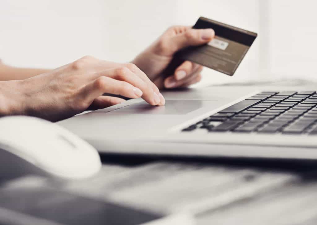 Woman is shopping online with laptop